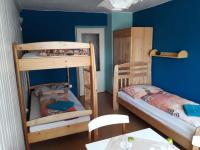 Postel nebo postele na pokoji v ubytování Apartmán Pod Šeříkem
