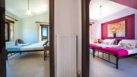 Posteľ alebo postele v izbe v ubytovaní Villas Louloudaki