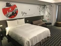 a hotel room with a bed and a sign on the wall at Chiayi Look Hotel in Chiayi City