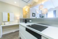 A kitchen or kitchenette at MD Pelayo