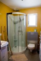 a bathroom with a shower and a toilet at Gîte Les Bourdettes in Auvillar