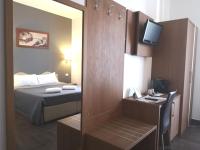 Posteľ alebo postele v izbe v ubytovaní Rome Travellers Hotel