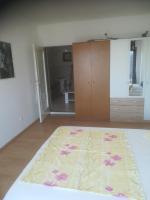 Postel nebo postele na pokoji v ubytování Apartmani Huljev