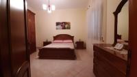 A bed or beds in a room at Appartamento 3