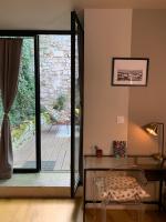 a room with a glass door leading to a patio at T2 centre ville avec extérieur in Avignon