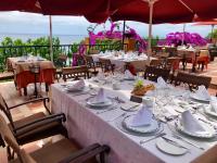 una mesa preparada para una comida en un restaurante en Rigat Park & Spa Hotel - Adults Recommended, en Lloret de Mar