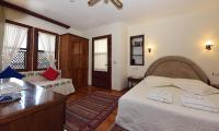 A bed or beds in a room at Villa Konak Hotel