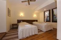 A bed or beds in a room at Villa Konak Hotel