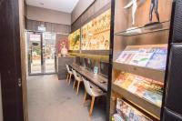 a restaurant with a table and chairs in a store at Global Traveler Hotel in Kaohsiung