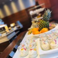 a buffet line with desserts and fruit in jars at Hotel Vitality in Vendryně