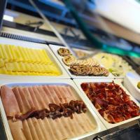 a buffet of different types of food on a table at Hotel Vitality in Vendryně