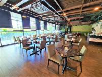 En restaurant eller et andet spisested på Nexus Business Suite Hotel