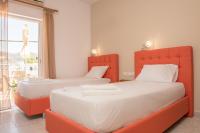 Posteľ alebo postele v izbe v ubytovaní Nikos Rooms