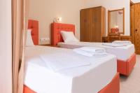 Posteľ alebo postele v izbe v ubytovaní Nikos Rooms