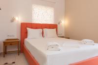 Posteľ alebo postele v izbe v ubytovaní Nikos Rooms