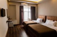 A bed or beds in a room at Taksim Mood