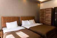 A bed or beds in a room at Taksim Mood