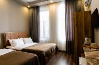A bed or beds in a room at Taksim Mood