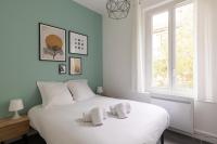 Una cama o camas en una habitaci&oacute;n de DIFY Gouraud - Lyon 8