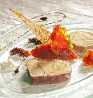 a glass plate with food on a table at Château des Monthairons Hôtel Restaurant GastroMaison Spa privatif in Les Monthairons