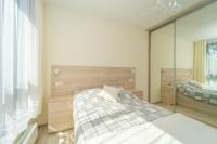 Posteľ alebo postele v izbe v ubytovaní APARTAMENT PORTOVA Gdynia