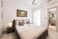 A bed or beds in a room at Panos Villa Sunset View