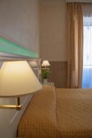 Łóżko lub łóżka w pokoju w obiekcie Hotel Palladium Palace
