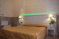 Łóżko lub łóżka w pokoju w obiekcie Hotel Palladium Palace