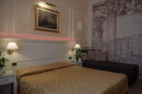 Łóżko lub łóżka w pokoju w obiekcie Hotel Palladium Palace