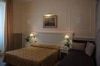 Łóżko lub łóżka w pokoju w obiekcie Hotel Palladium Palace