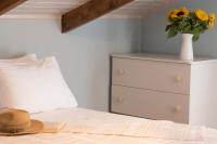 A bed or beds in a room at The Loft