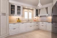 A kitchen or kitchenette at Panos Villa Sunset View