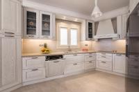 A kitchen or kitchenette at Panos Villa Sunset View