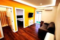 Televízia a/alebo spoločenská miestnosť v ubytovaní Sorrento Punto It Apartment