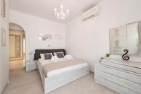 A bed or beds in a room at Panos Villa Sunset View