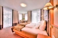 Posteľ alebo postele v izbe v ubytovaní Hotel Garni Urezza