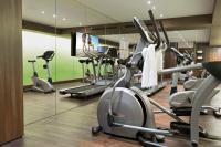a gym with cardio machines and a flat screen tv at Holiday Inn Vienna City by IHG in Vienna