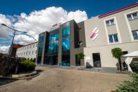 a building with a sign on the front of it at Hotel Sękowski in Legnica