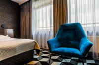 Łóżko lub łóżka w pokoju w obiekcie Hotel Wyspiański