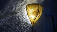 a lamp hanging from a wall in a room at Casa Cueva “La Estrella” in Granada