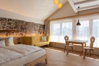 Posteľ alebo postele v izbe v ubytovaní Weingut Schmid Oberrautner Apartment Suites