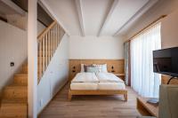 Posteľ alebo postele v izbe v ubytovaní Weingut Schmid Oberrautner Apartment Suites