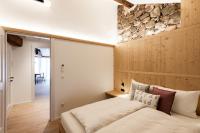 Posteľ alebo postele v izbe v ubytovaní Weingut Schmid Oberrautner Apartment Suites
