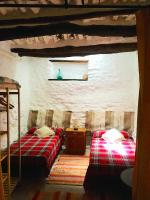 Łóżko lub łóżka w pokoju w obiekcie Apartamento El Refugio de Mecina