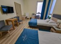 Posteľ alebo postele v izbe v ubytovaní Antonińska Hotel & Apartamenty