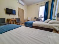 Posteľ alebo postele v izbe v ubytovaní Antonińska Hotel & Apartamenty