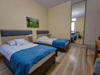 Posteľ alebo postele v izbe v ubytovaní Antonińska Hotel & Apartamenty