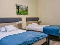 Posteľ alebo postele v izbe v ubytovaní Antonińska Hotel & Apartamenty