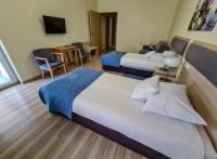 Posteľ alebo postele v izbe v ubytovaní Antonińska Hotel & Apartamenty