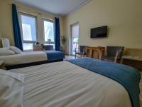 Posteľ alebo postele v izbe v ubytovaní Antonińska Hotel & Apartamenty
